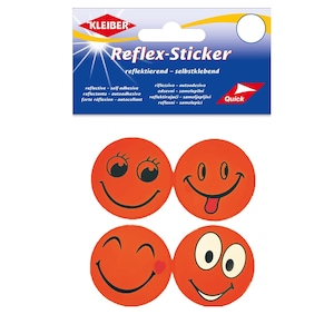 Könnte beinhalten: Vier kreisförmige, orangefarbene Reflex-Sticker auf einer Verkaufskarte mit der Aufschrift KLEIBER Reflex-Sticker. Jeder Aufkleber zeigt ein einzigartiges schwarzes Smiley-Gesicht, darunter Ausdrücke mit Wimpern, herausgestreckter Zunge, Zwinkern und großen Augen.