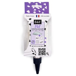 Könnte beinhalten: Eine weiße und violette Odif 707 repositionierbare Klebstoffflasche mit schwarzer Kappe. Das Etikett zeigt den Text Odif 707 Adhésif Repositionnable, einen QR-Code und ein Nettogewicht von 60 g. Die Verpackung enthält Symbole für die Stoffanwendung.
