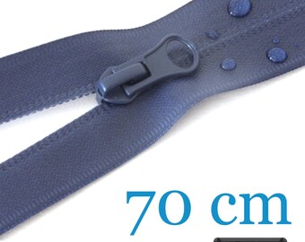 May include: A dark blue zipper with a matching pull tab and water droplets on the fabric tape. The text 70 cm is displayed in blue, and a small black rectangular label contains the white text 5 Farben, indicating a length of 70 cm.