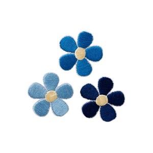 May include: Three embroidered flower patches in varying shades of blue. Each flower features five rounded petals and a circular cream-colored center. The top flower is medium blue, the bottom left is light blue, and the bottom right is dark navy blue.