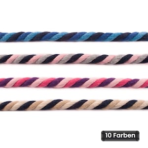 Könnte beinhalten: Vier horizontale Stränge aus gedrehtem Kordelmaterial, jeder mit einem einzigartigen dreifarbigen Muster. Die oberste Kordel ist blau und schwarz, die zweite rosa, grau und schwarz, die dritte rosa, lila und hellrosa, die unterste beige und schwarz. Text: 10 Farben.