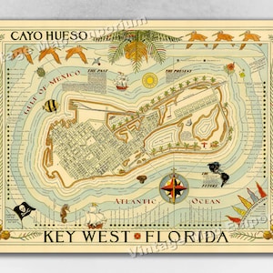 May include: A vintage map of Key West, Florida, with a whimsical design. The map features a stylized depiction of the island, surrounded by water and decorated with birds, fish, and ships. The text "Cayo Hueso" and "Key West Florida" are prominently displayed.