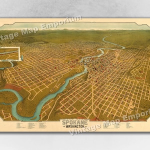 May include: An antique map of Spokane, Washington, showing the city's layout and surrounding landscape. The map is in a vintage style with a yellowed background and brown lines. The text "Spokane, Washington" is printed in the lower right corner.