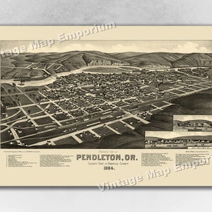 May include: A vintage black and white aerial view map of Pendleton, Oregon, from 1884. The map shows the layout of the city with streets, buildings, and the Umatilla River.