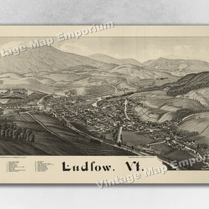 May include: A vintage black and white illustration of Ludlow, Vermont. The image shows a bird's eye view of the town, with rolling hills and a river running through it. The text "Ludlow. Vt." is printed at the bottom of the image.