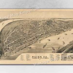May include: An antique, black and white, bird's-eye view map of Cairo, Illinois, from 1883. The map shows the city's layout, streets, and buildings, with the Ohio River running through the center. The map is titled "Perspective Map of the City of Cairo, Ill., 1883."