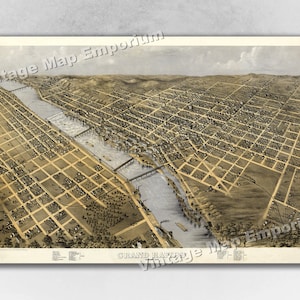 May include: An antique bird's-eye view map of Grand Rapids, Michigan, showing the city's layout and the Grand River flowing through it. The map is printed in brown and black ink on a cream-colored paper.