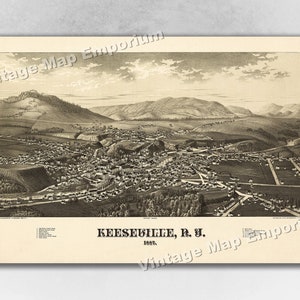 May include: A vintage black and white bird's eye view map of the town of Keeseville, New York, from 1887. The map shows the town's layout, including streets, buildings, and surrounding landscape. The text "KEESEVILLE, R. I. 1887" is printed at the bottom of the map.