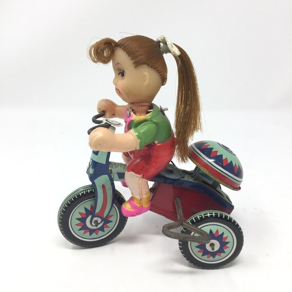 girl on tricycle