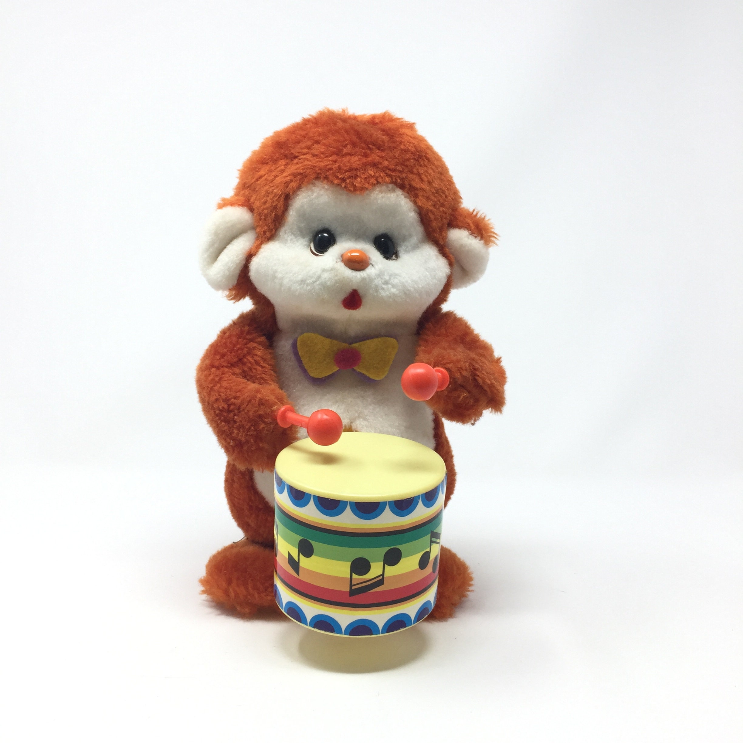 monkey toy playing drums