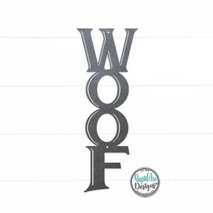 May include: A metal sign with the word "WOOF" in vertical letters. The letters are in a vintage style font and are painted a dark gray color.
