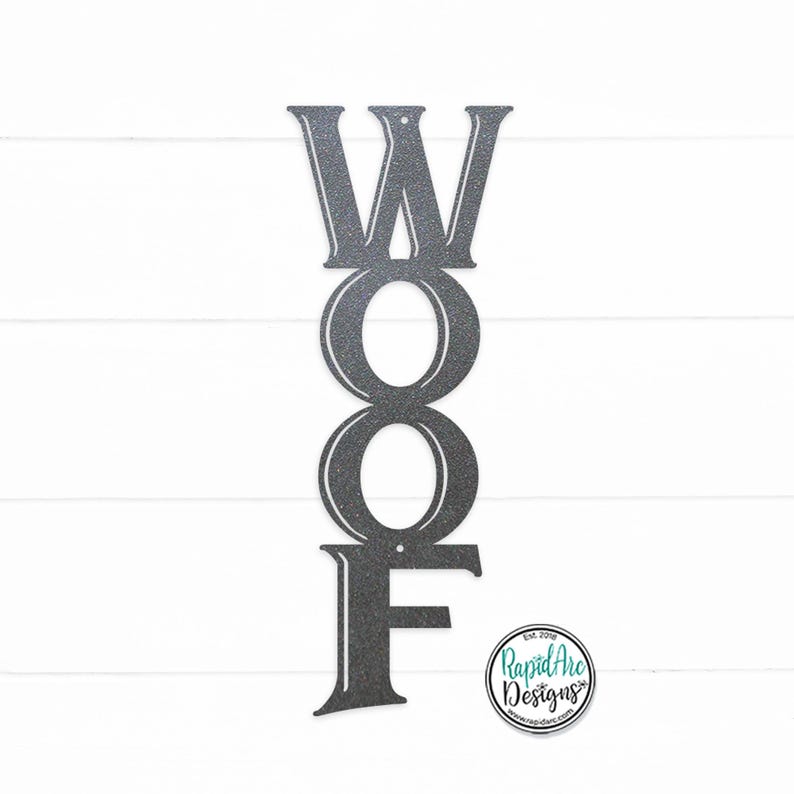 May include: A metal sign with the word "WOOF" in vertical letters. The letters are in a vintage style font and are painted a dark gray color.
