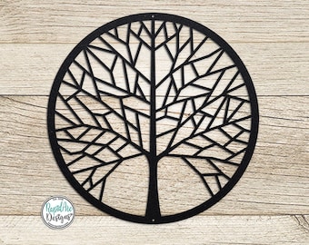 May include: Black metal wall art featuring a geometric tree design. The tree has a circular shape and intricate branches.