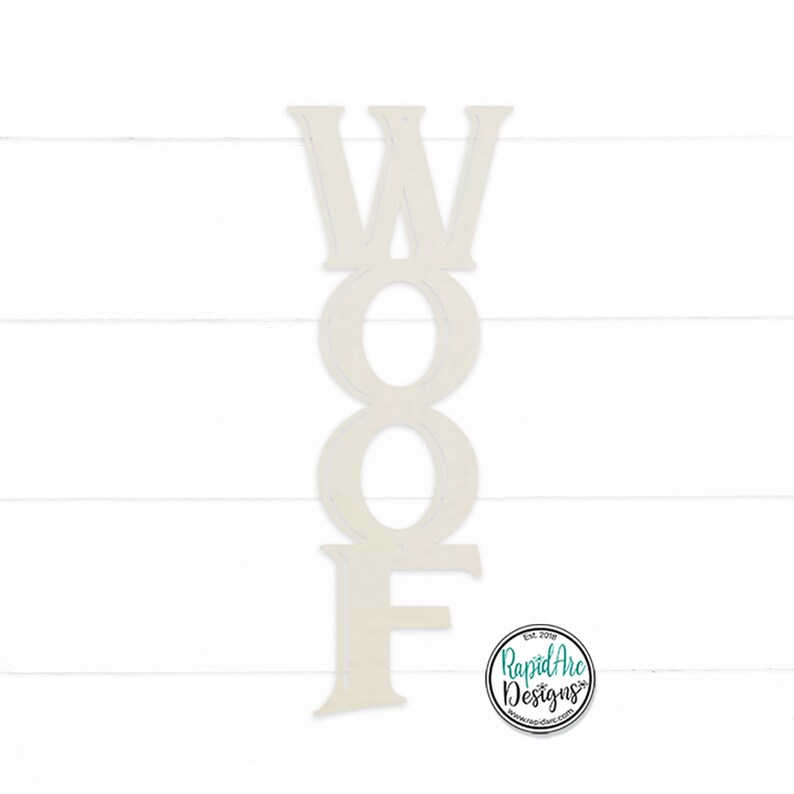 May include: White wooden letters spelling out the word "WOOF" in a vertical stack. The letters are painted white and have a rustic, unfinished look.