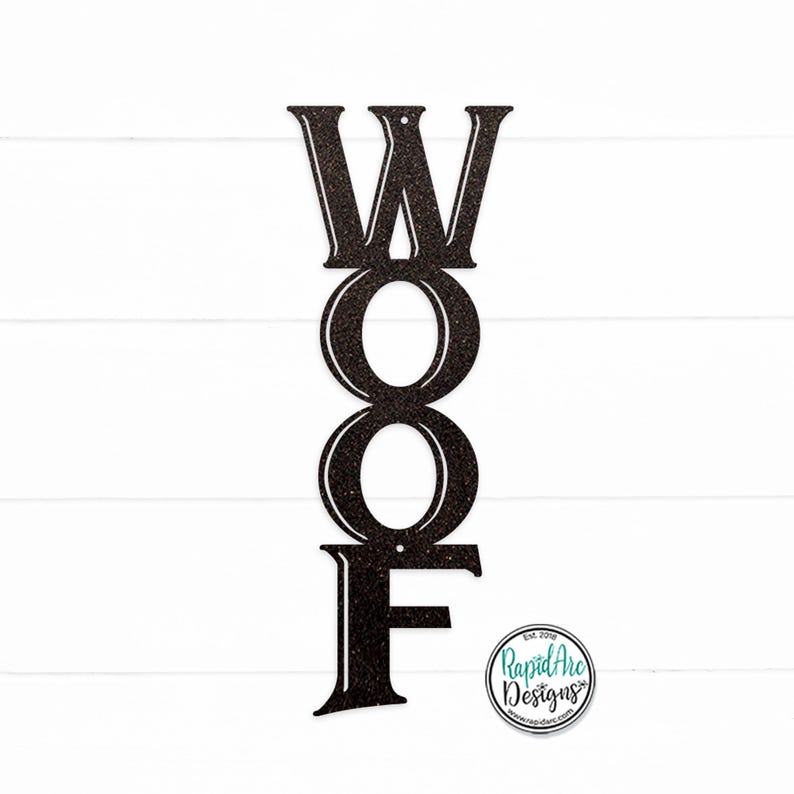 May include: Black metal sign with the word "WOOF" in large, stylized letters. The letters are stacked vertically, with the "W" at the top and the "F" at the bottom. The sign is designed to be hung on a wall or door.