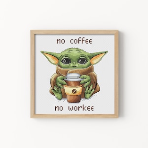 May include: Cross-stitch pattern featuring a green, cartoon character holding a cup of coffee. The text "no coffee no workee" is below the character.