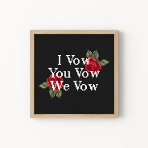 May include: A framed black and white cross-stitch with red roses and the text "I Vow You Vow We Vow".