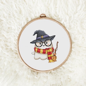 May include: A white ghost wearing a black witch hat with a lightning bolt, red and yellow scarf, and round glasses, holding a broom.