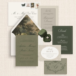May include: An assortment of wedding stationery in shades of green, cream, and white. Includes invitations, RSVP cards, and an envelope with a landscape-style liner. A ring in a green velvet box is also present.