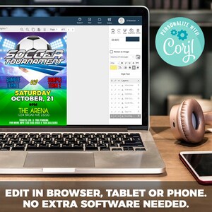 May include: A laptop computer screen displaying a soccer tournament flyer with a green and white background. The flyer has a soccer ball graphic, the text "Soccer Tournament", and the date "Saturday October, 21". The flyer also includes the time "9PM", the location "The Arena", and the address "1234 Broad Ave 23220". The text "Tickets $20 | Free Parking" is also included. The laptop is on a wooden table with a pair of headphones and a smartphone.
