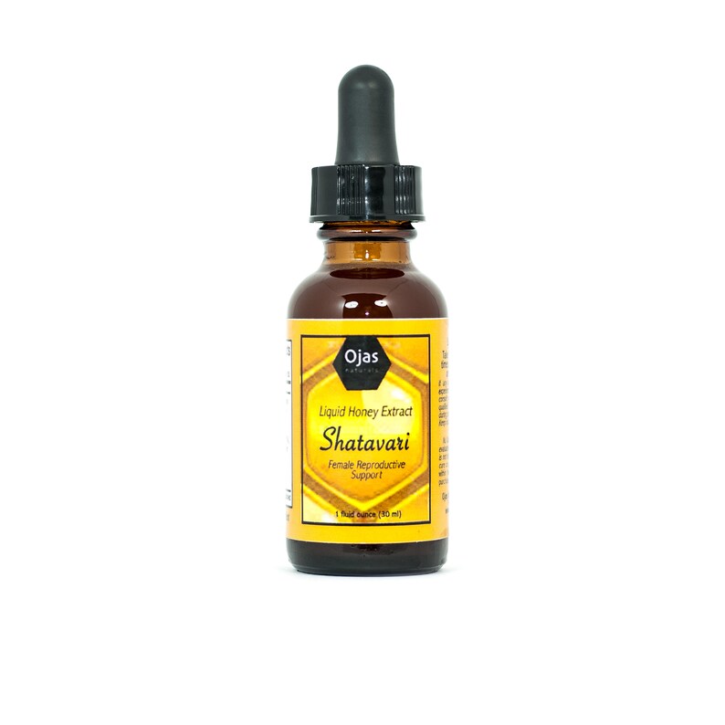 K&ouml;nnte beinhalten: Eine braune Glasflasche mit Tropfer. Das Etikett ist gelb und schwarz und lautet "Ojas Naturals Liquid Honey Extract Shatavari Female Reproductive Support 1 fluid ounce (30 ml)"