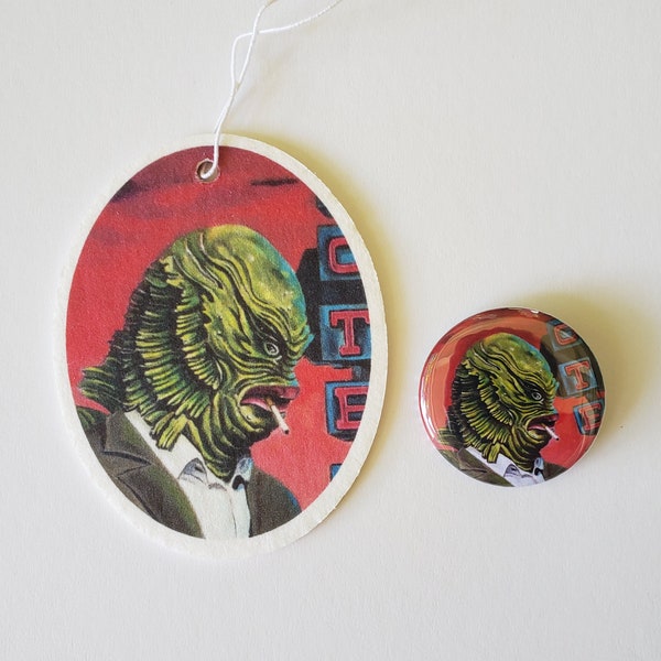 Car air freshener, hanging and pin back button set. Satire of Creature from the Black Lagoon  Made in the USA