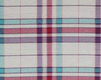 May include: Close-up of a fabric with a plaid pattern. The design features a white background with intersecting lines in red, purple, and teal. The lines create a grid-like pattern, suitable for textiles and crafts.