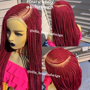 May include: A burgundy braided wig with a lace front. The wig is styled in a long, straight style. The wig is shown on a mannequin head. The text #burgundy allthrough and @ella_braidedwigs is visible in the image.