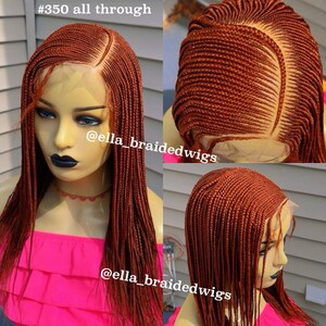 May include: A close-up of a brown braided wig with a lace front. The wig is styled in a straight, long style. The wig is on a mannequin head. The text "#350 all through" and "@ella_braidedwigs" is visible in the image.