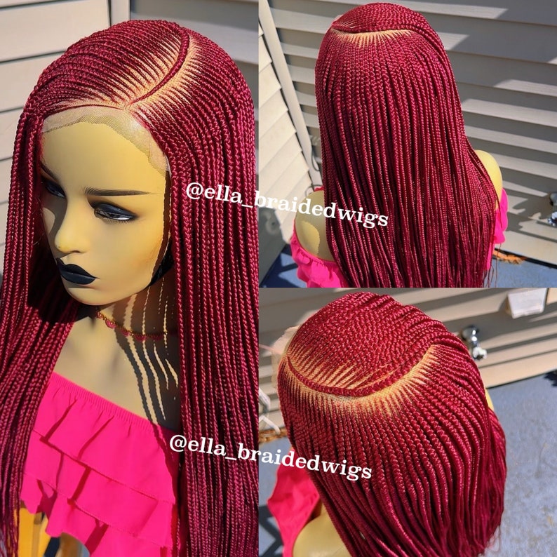May include: A burgundy braided wig with a lace front. The wig is styled in a long, straight style. The wig is shown on a mannequin head. The text "@ella_braidedwigs" is visible on the image.
