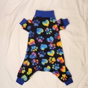 Black Fleece With Brightly Colored Tie Dye Paws And Hearts.. Jammies/PJ&#39;s/Onesie. Stretch Knit Cuff And Collar.  Custom Sizing Offered
