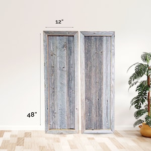 May include: Two weathered wood panels, each measuring 48 inches tall and 12 inches wide, with a light gray and brown color scheme. The panels are framed with a thin, natural wood border.