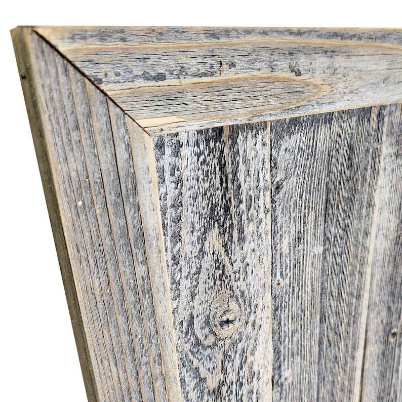 May include: A close-up of a rustic wooden frame with a weathered gray and white finish. The frame is made of reclaimed wood and has a natural, distressed look.
