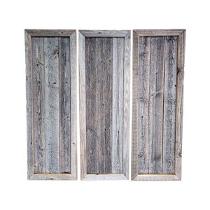 May include: Three rustic wood framed panels with a weathered gray and brown finish. The panels are arranged side by side and have a natural wood grain.