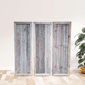 May include: Three rustic wood framed panels with a light gray and white washed wood finish. The panels are arranged vertically and are all the same size.