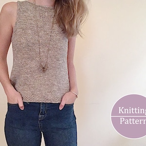 May include: A sleeveless, knitted top in a neutral beige color. The top has a round neckline and a close fit. The person is wearing blue jeans. A pendant necklace and a bracelet are visible. The image includes a circular graphic that says "Knitting Pattern".