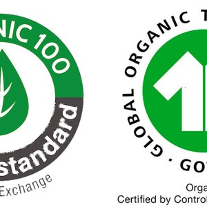 May include: Two green and white circular labels with text and symbols. The first label has a green leaf on a gray background with the text "ORGANIC 100 content standard &copy; Textile Exchange". The second label has a white silhouette of two t-shirts on a green background with the text "GLOBAL ORGANIC TEXTILE STANDARD GOTS Organic Certified by Control Union CU811033".
