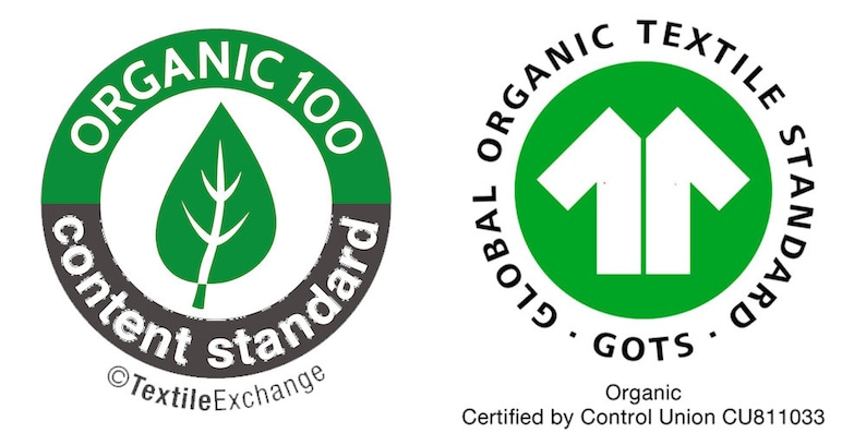 May include: Two green and white circular labels with text and symbols. The first label has a green leaf on a gray background with the text "ORGANIC 100 content standard &copy; Textile Exchange". The second label has a white silhouette of two t-shirts on a green background with the text "GLOBAL ORGANIC TEXTILE STANDARD GOTS Organic Certified by Control Union CU811033".