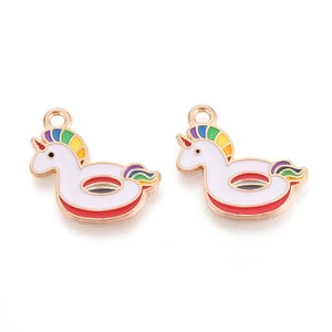 May include: Two unicorn-shaped charms. Each charm features a white body with a red and black stripe, a rainbow mane, and a gold-colored loop at the top. The charms are designed to resemble a pool float.