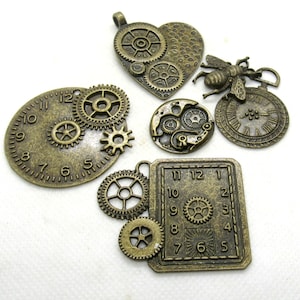 May include: Assortment of bronze-colored metal charms with a steampunk theme. The charms feature clock faces, gears, and a bee design.
