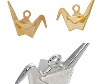May include: Two gold and one silver origami crane charms. The charms are made of metal and have a loop for hanging.