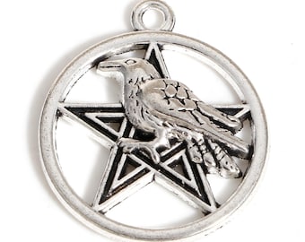 May include: Silver pendant featuring a raven perched on a pentagram. The raven is detailed with textured feathers and the pentagram is outlined in black.