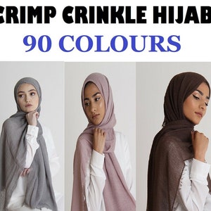 May include: Three women wearing different coloured crinkle hijab head scarves. The scarves are grey, pink, and brown. The text "CRIMP CRINKLE HIJAB 90 COLOURS" is at the top of the image.
