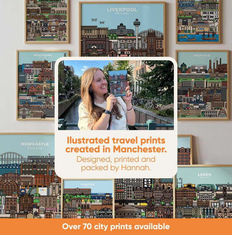 May include: A collection of framed city prints featuring detailed illustrations of various cityscapes. The prints are displayed with a light blue background and wooden frames. The text reads "Illustrated travel prints created in Manchester. Designed, printed and packed by Hannah."