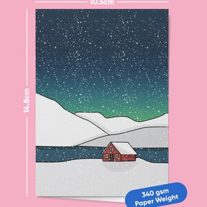 May include: A winter landscape illustration featuring a red cabin nestled in a snowy scene under a starry night sky. The print measures 10.5cm wide and 14.8cm tall. The paper weight is 340 gsm.