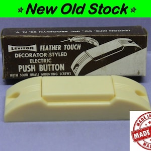May include: A vintage ivory-colored Leviton Feather Touch push button with solid brass mounting screws. The button is in its original box, which reads "Leviton Feather Touch Decorator Styled Electric Push Button with Solid Brass Mounting Screws".