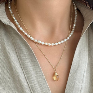 Stacking necklaces set with 
a Raw Citrine Necklace
a Seed pearl necklace.

This  Citrine crystal Necklace is a great idea for a Scorpio gift.

A dainty set with a Real Pearl Necklace and a  citrine Necklace
Handmade with 925 Sterling Silver and gems