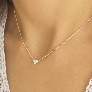 Minimalist heart Necklace with an extra tiny heart pendant
Sterling Silver 925   
The small heart necklace adds a sparkling shine to your style.
With a matt but shiny finish that makes is so unique!

Ideal for a birthday or Bridesmaid Gift
