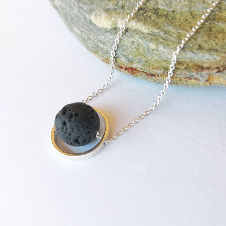 Aromatherapy necklace

Just drop a few drops of essential oil on the lava rock.

 The Lava stone emerges a great aroma that is so lovely.
 This lava rock pendant necklace is crafted exclusively by solid sterling silver 925 and natural lava stone.