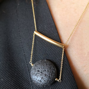 This real lava necklace is great Aromatherapy jewelry!

At the same time this 	Lava stone pendant, is a unique fidget necklace.
 
You will love this LAVA rock Diffuser Necklace.

Natural lava stone 
925 sterling silver that is yellow gold filled